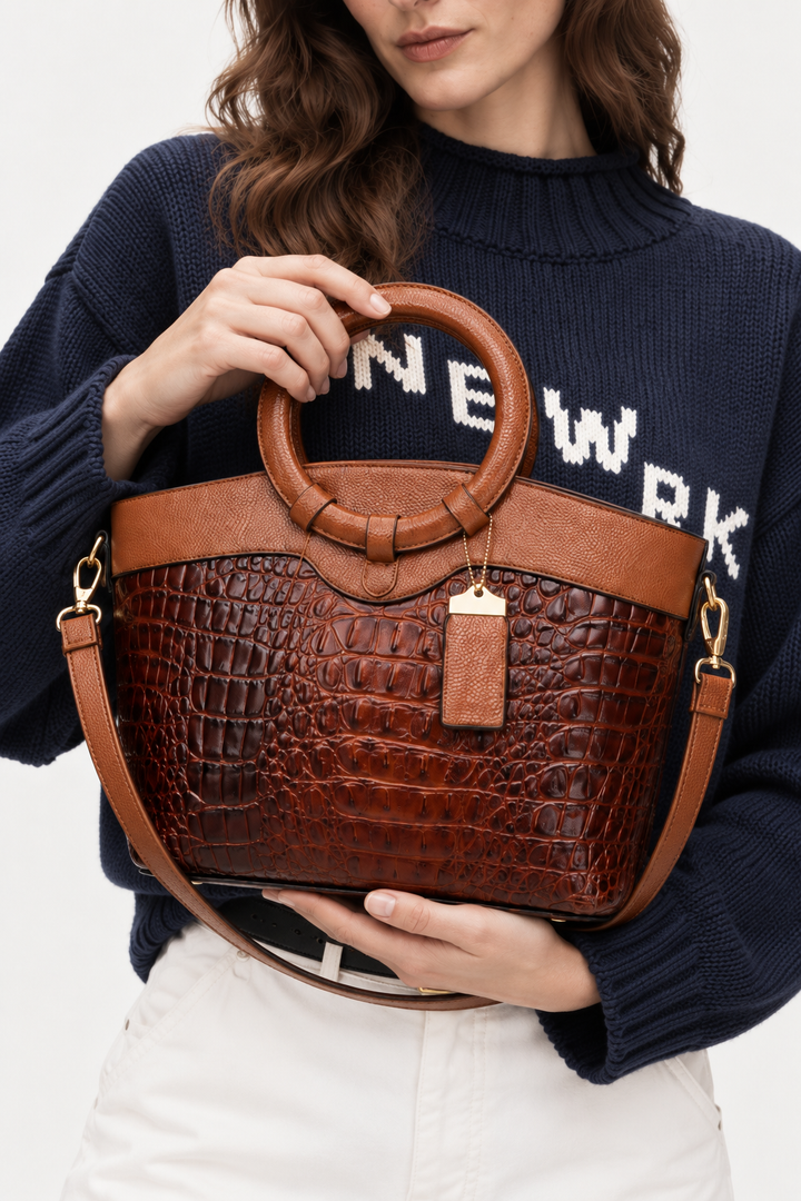Crocodile-embossed circular handle bag